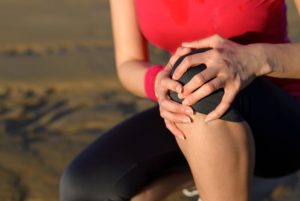 woman knee pain  300x201 Los Angeles Sports Medicine